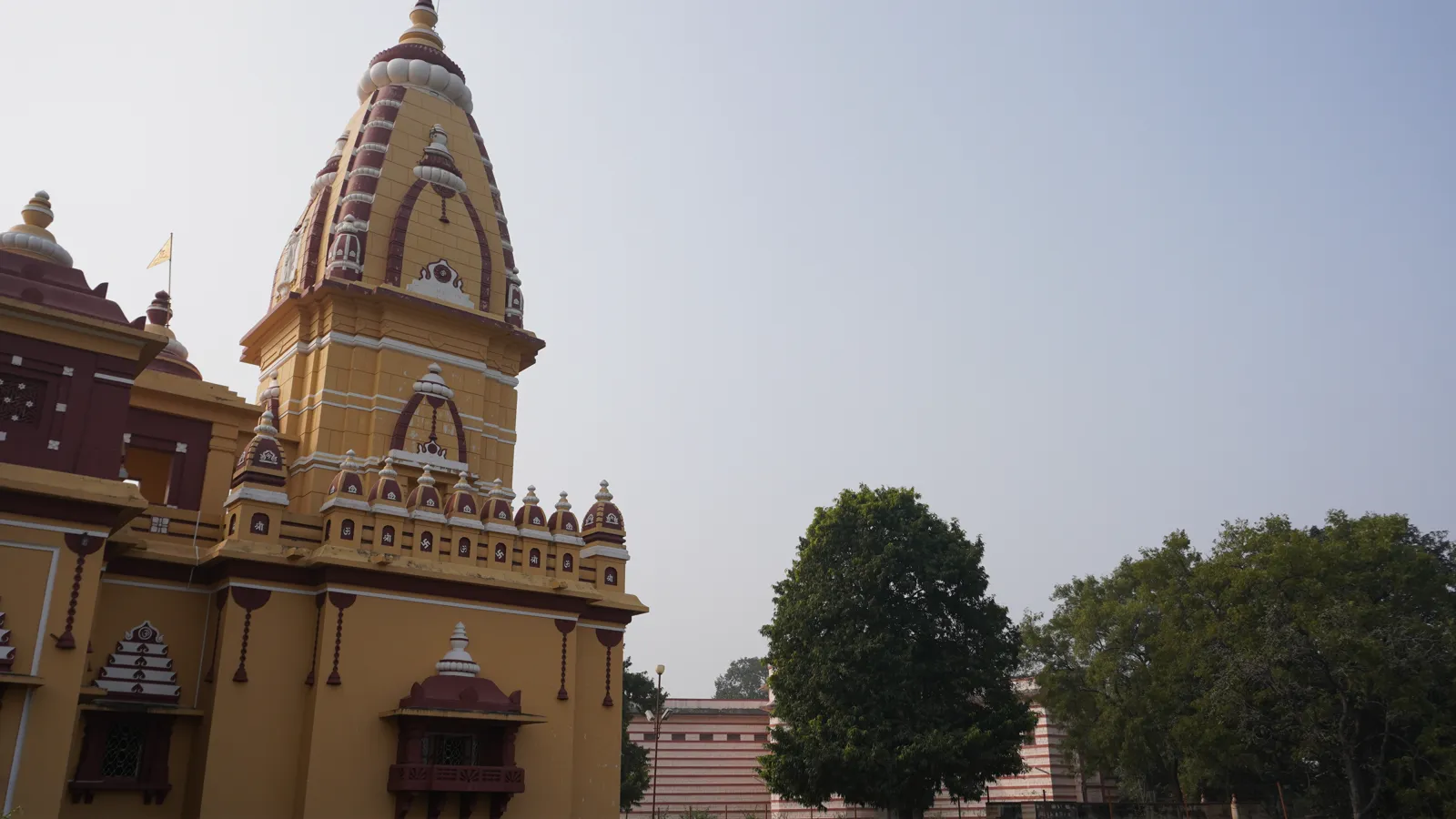 Close view of the yellow and maroon shikhara of Birla Mandir, Bhopal