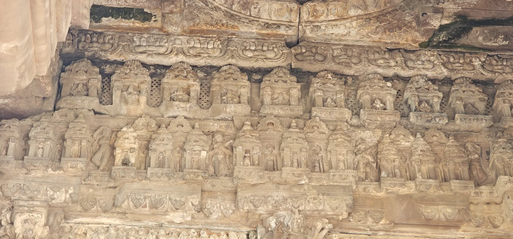 A carved frieze of figures on the Maladevi Temple