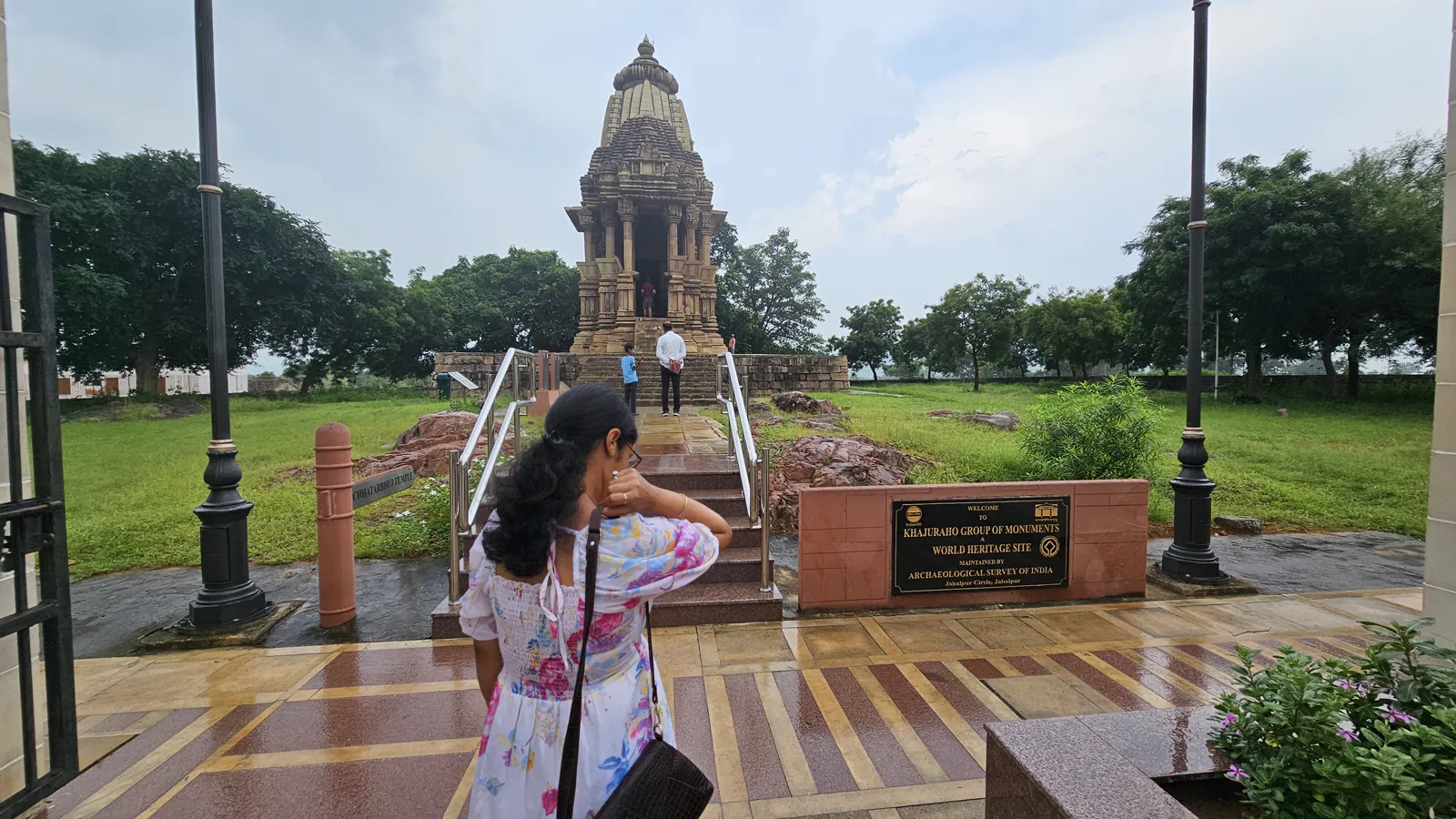 The long flight of steps up to the west-facing Chaturbhuj temple, people seen from behind