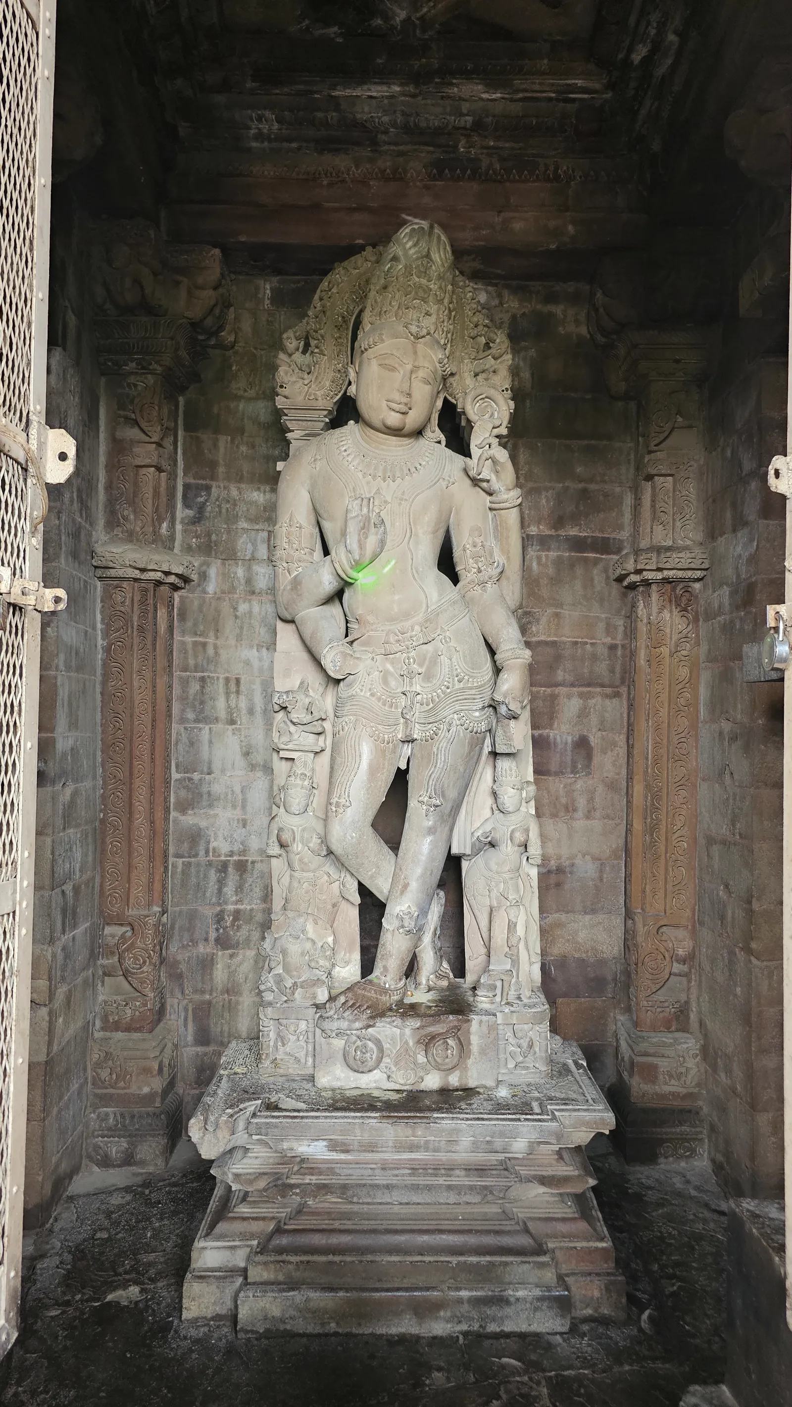 A close view of the serene nine-foot god image inside the Chaturbhuj temple