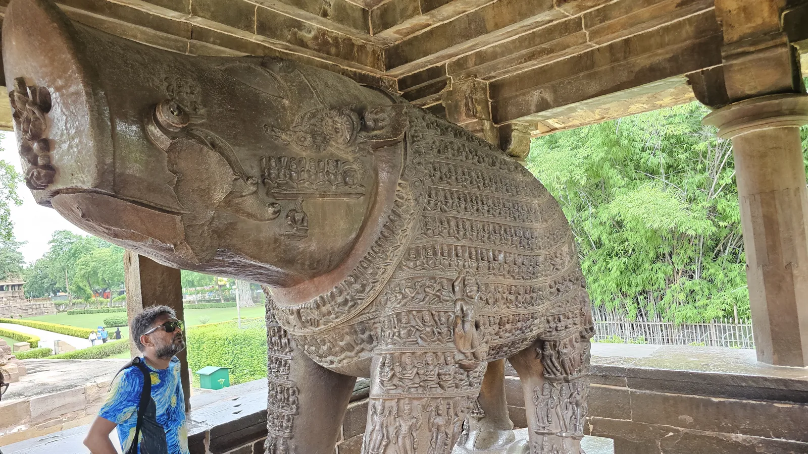 A carved frieze of a processing line of elephants on the temple platform