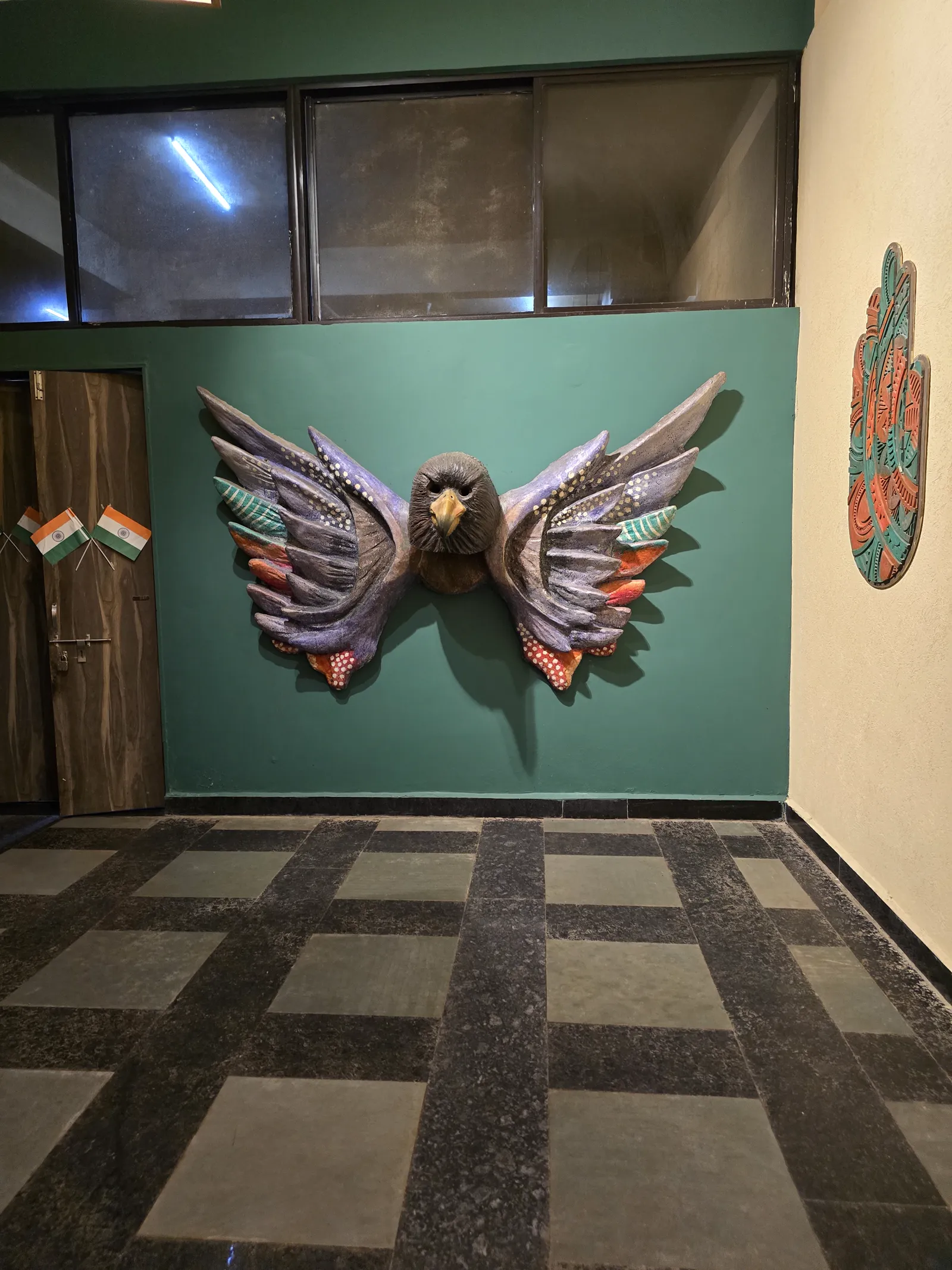 Winged mudra wall art at the MPT Gateway Retreat, Sanchi, where we stopped for dinner