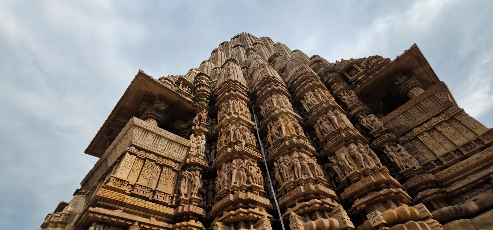 The colossal monolithic sandstone boar of the Varaha shrine, carved with hundreds of tiny deities
