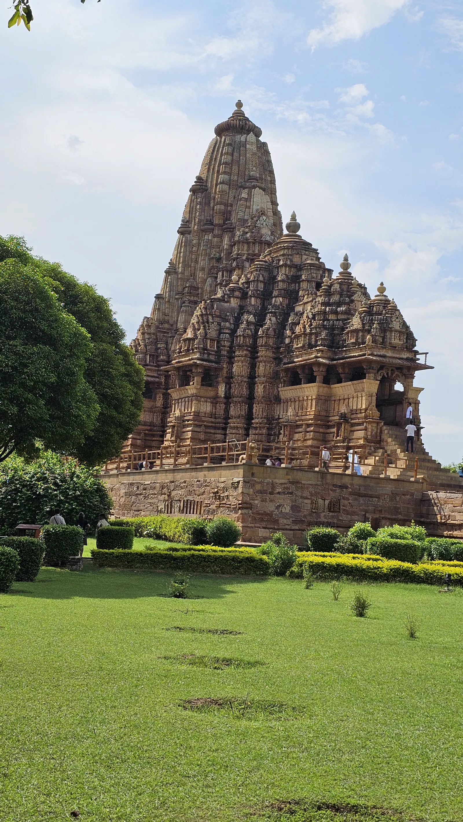 The green lawns of the Western Group complex with temple spires rising behind