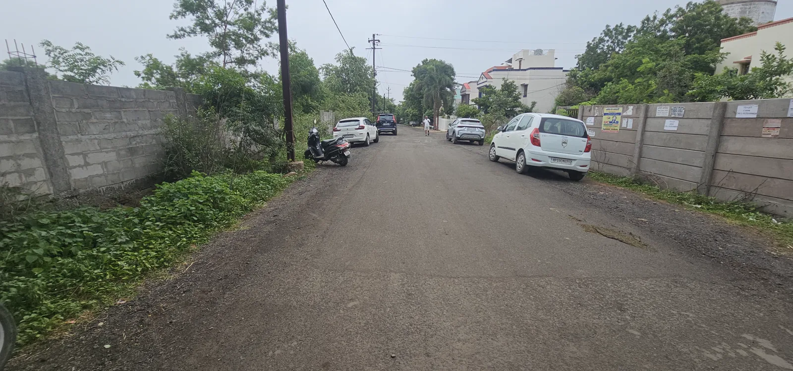 The approach road to Laharpur Ecological Park past the boundary wall