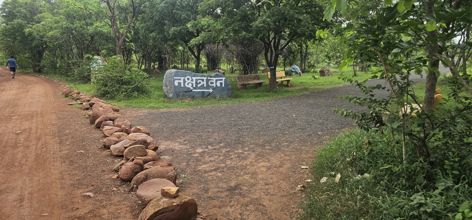 A painted rock reading Nakshatra Van marking the constellation garden at Laharpur