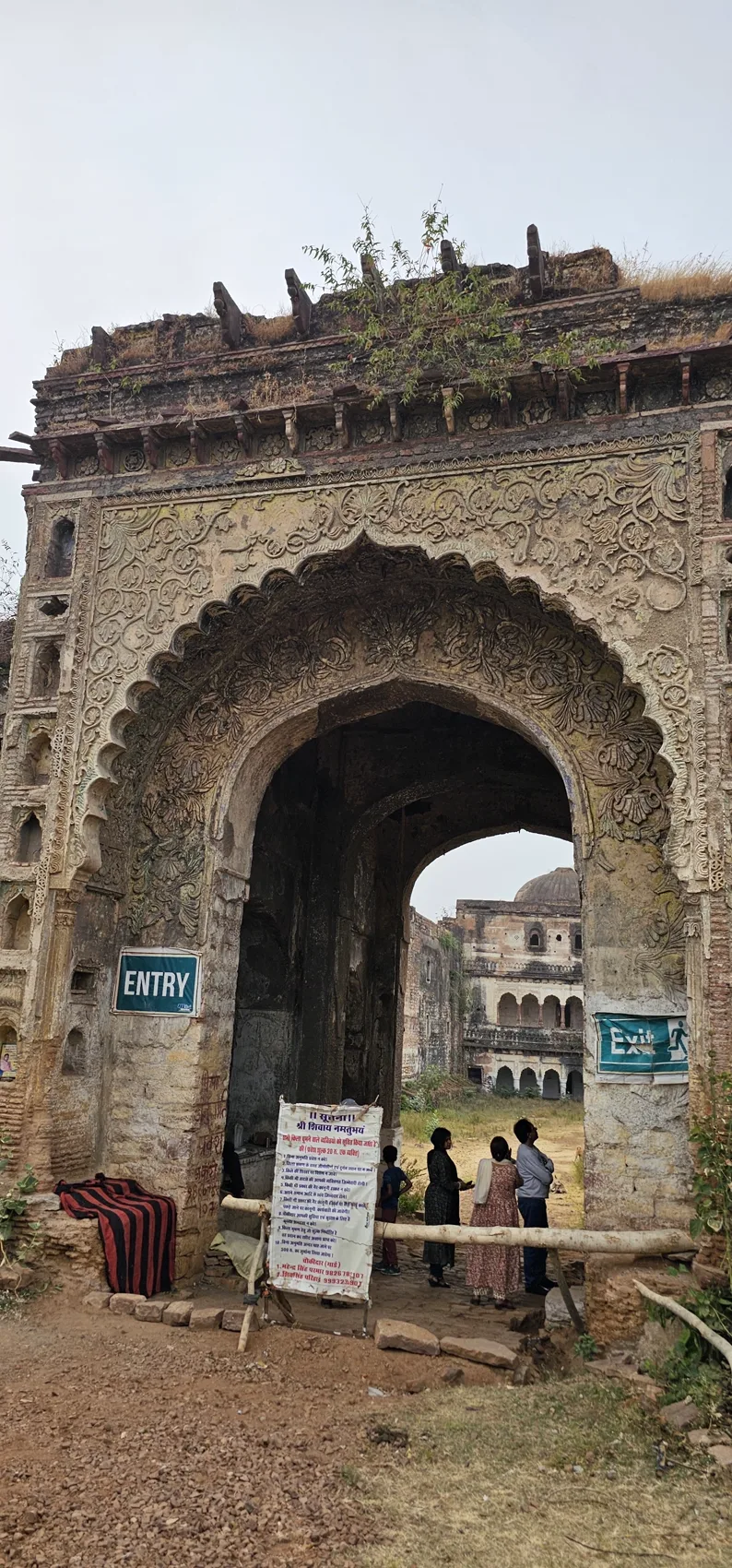 The weathered arched entrance gateway of Narsinghgarh Fort