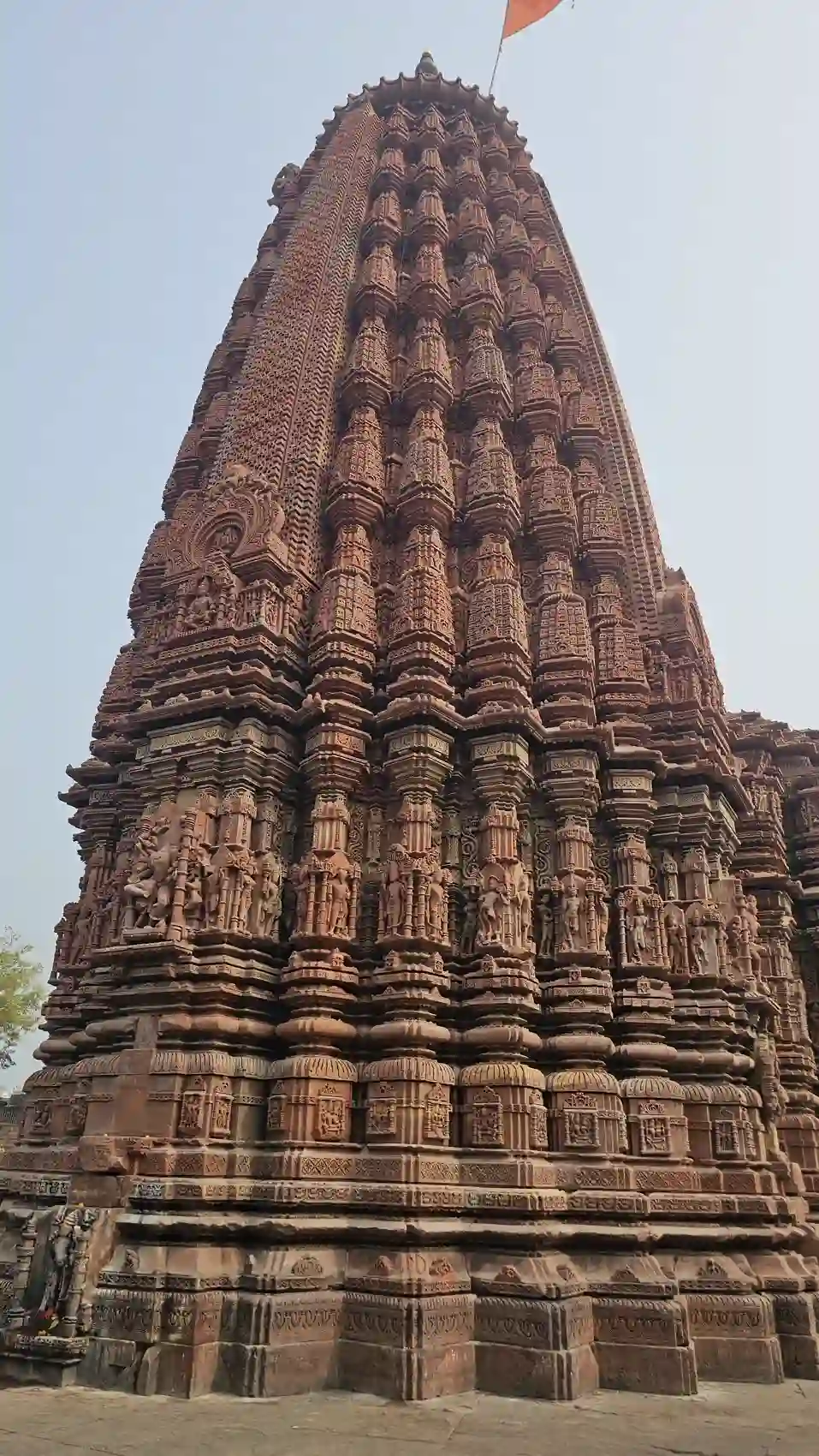The tall carved red-sandstone shikhara of the Neelkantheshwar Udayeshwar temple at Udaypur