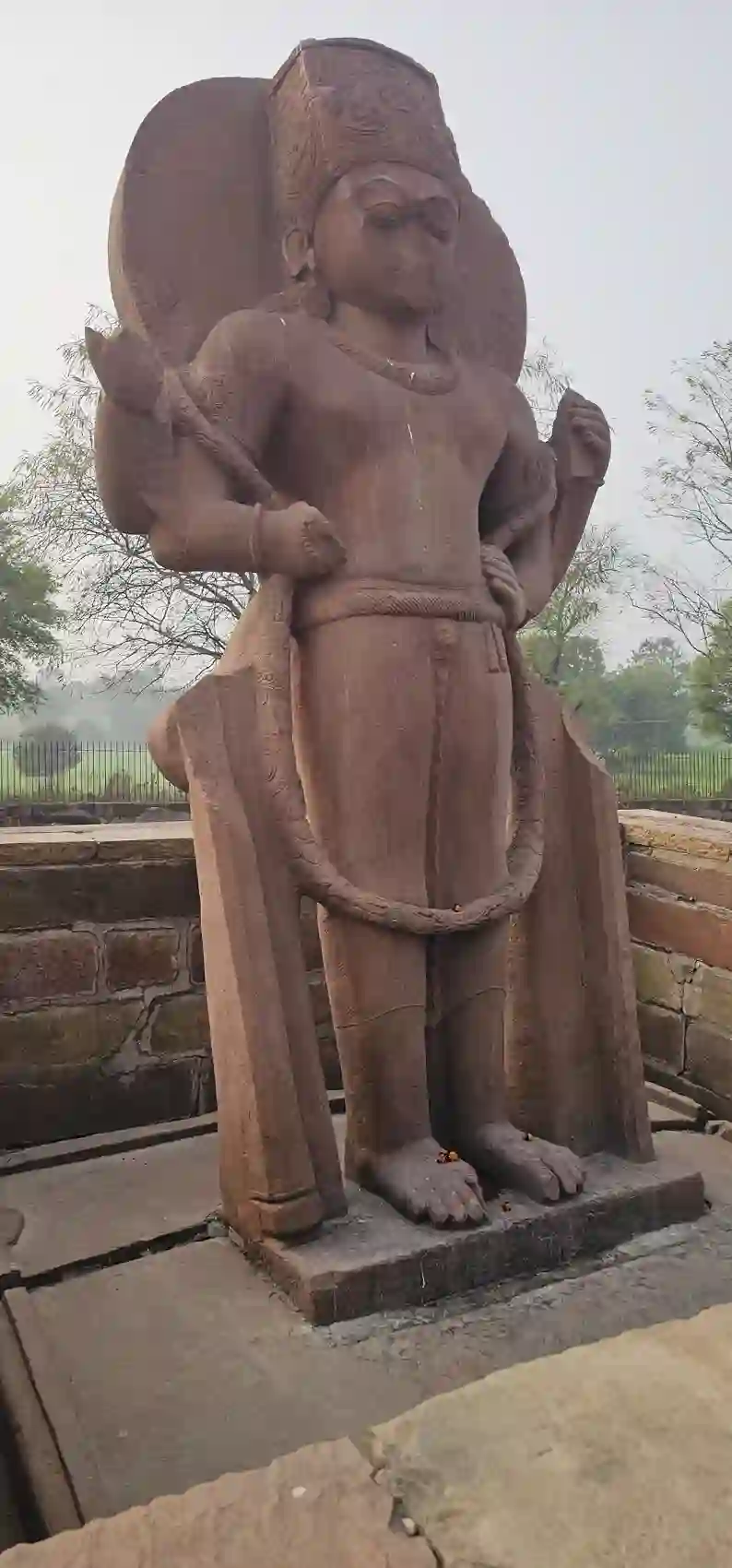 A tall standing stone Narasimha (man-lion) sculpture at Eran