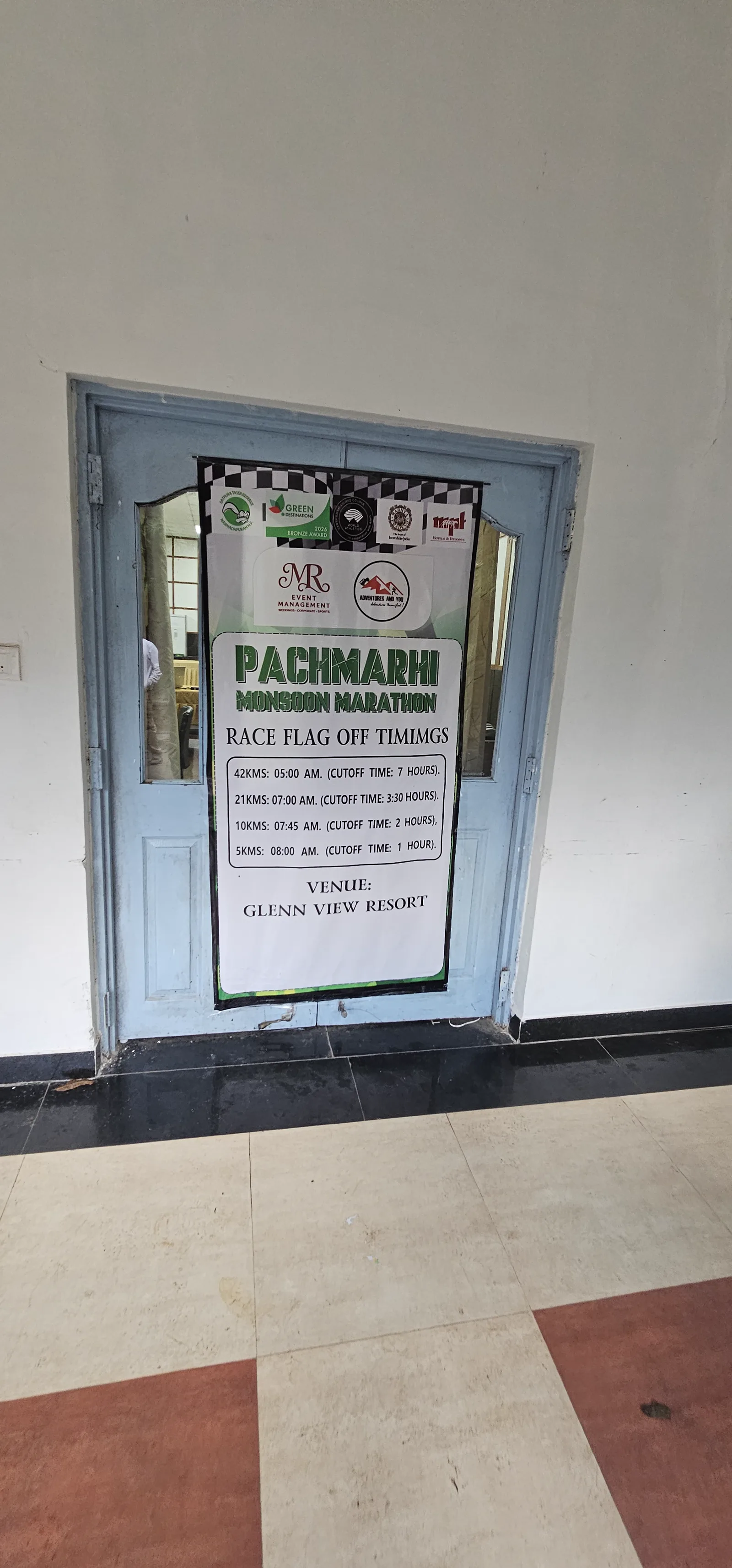 Pachmarhi Monsoon Marathon poster at the entrance of the race expo at MPT Glen View