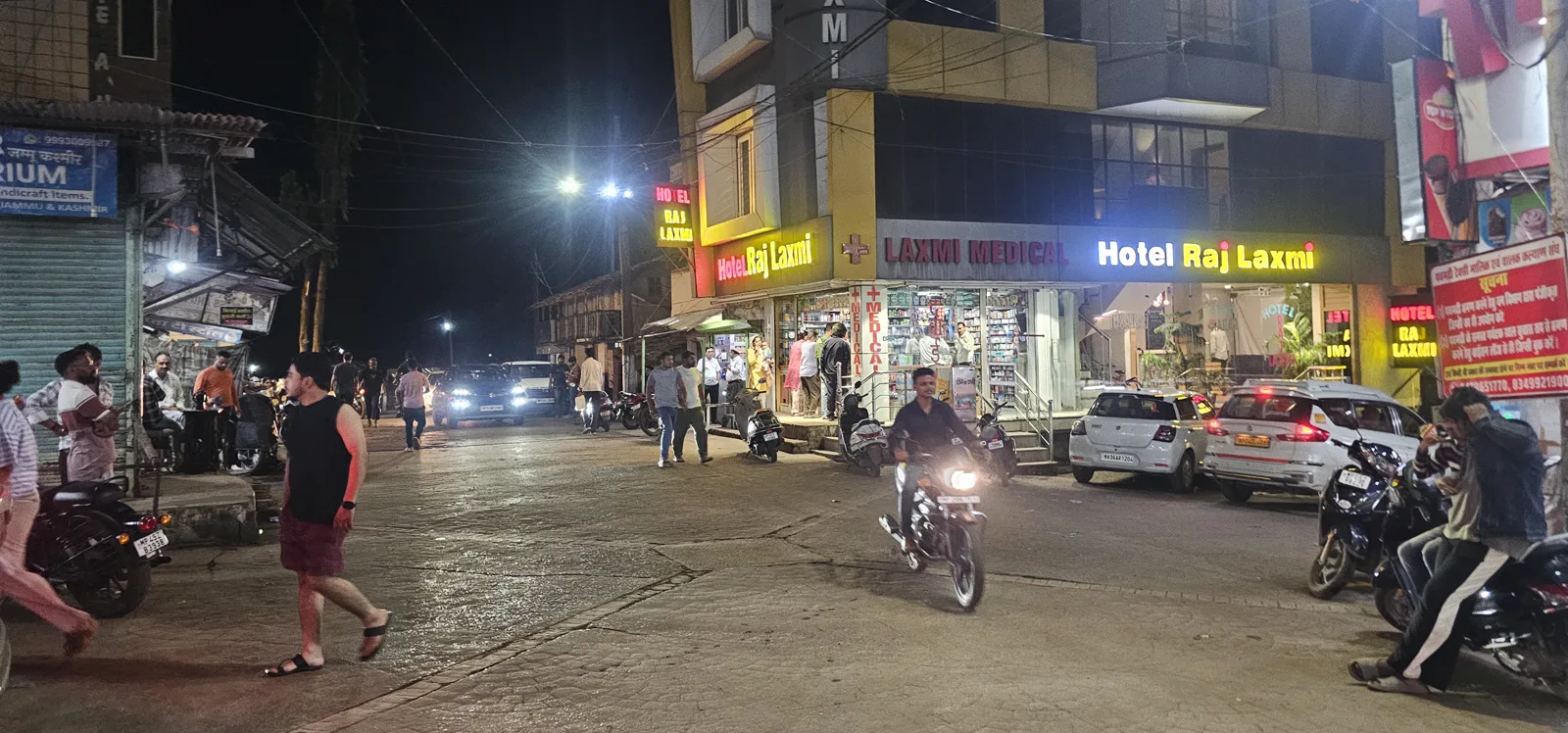 Pachmarhi market street at night before the marathon, hotels and shops lit up