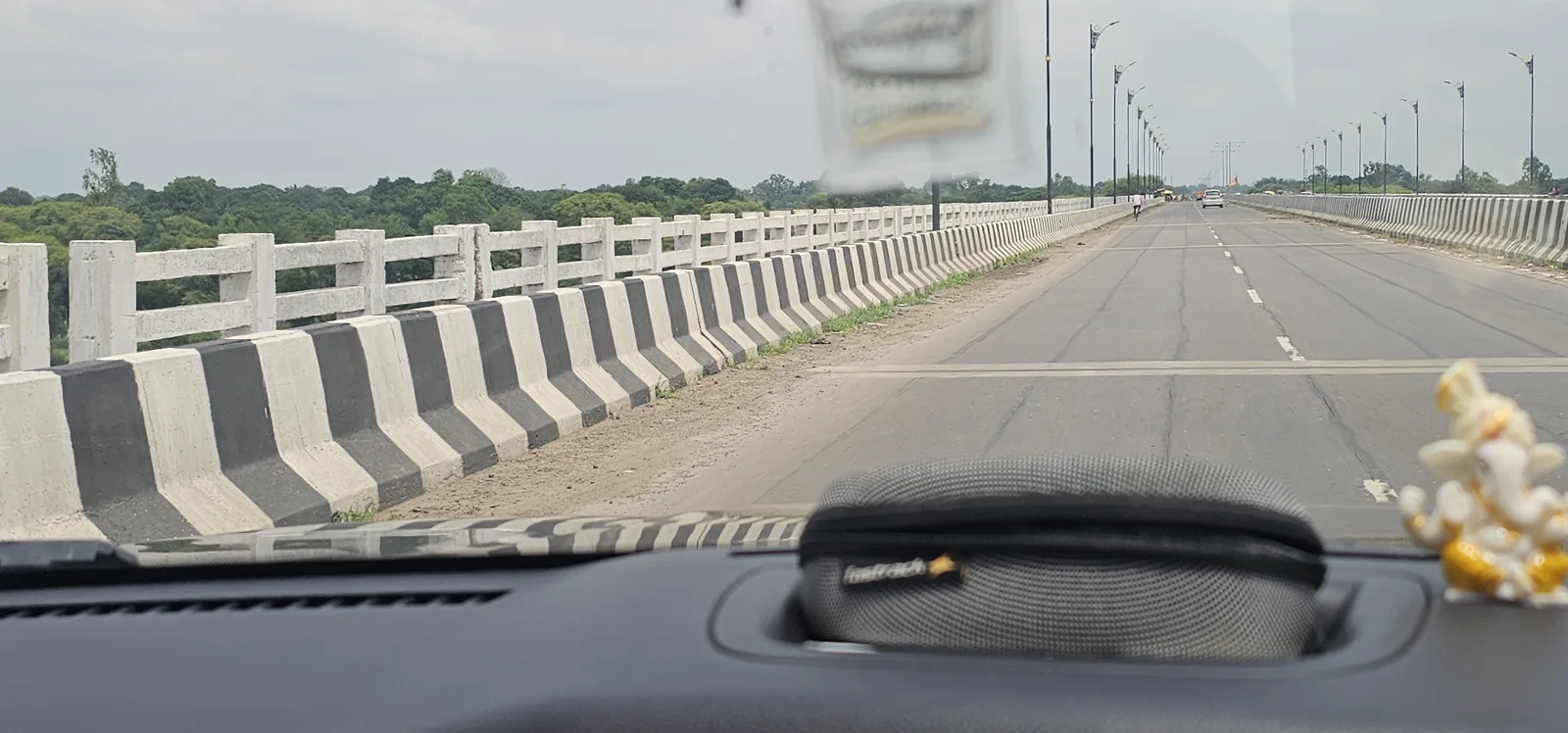 Crossing the wide Narmada river bridge on the way from Bhopal to Pachmarhi in the monsoon