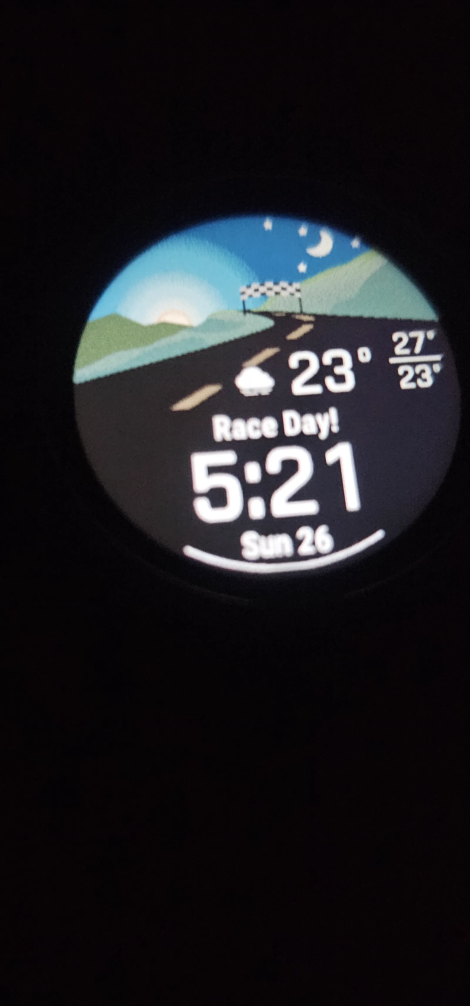 Smartwatch face on the morning of the Pachmarhi Monsoon Marathon reading Race Day at 5:21 am