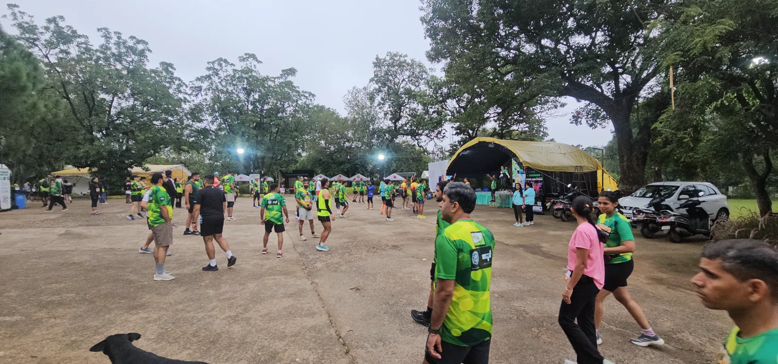 Runners warming up near the tents at the Pachmarhi Monsoon Marathon venue at dawn